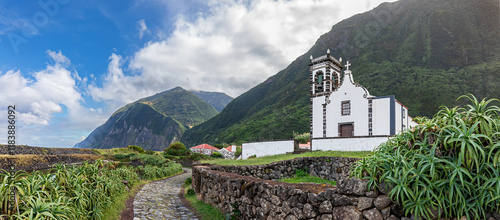 Panoramic view of small village Faja da Caldeira de Santo Cristo with church Santuario do Senhor Santo Cristo - Fajã da Caldeira at Sao Jorge Island - Azores