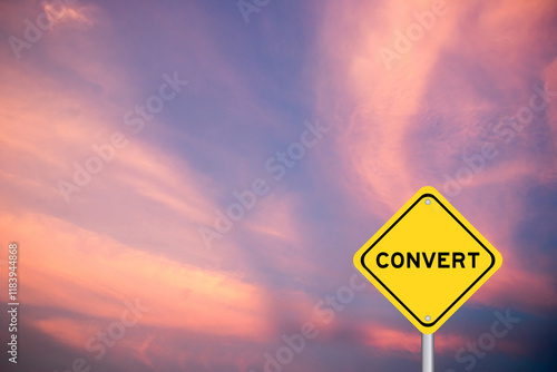 Photography Yellow transportation sign with word convert on violet color sky background