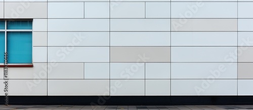 Facade of a modern office building with a large window. Wide photo. Minimalist Urban Wall with Blue Window