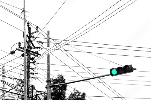 traffic light in green light in minimalist black and white. Electrical wire on street intersection