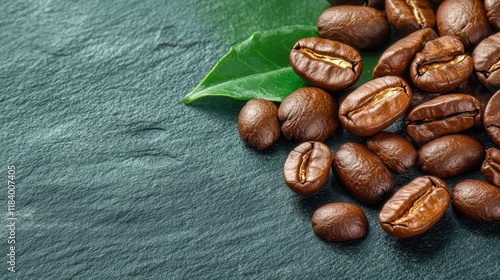 Close-up of roasted coffee beans on a textured surface, with a green leaf accent, Ideal for coffee-related marketing, culinary blogs, or packaging design to evoke a rich, aromatic experience, photo