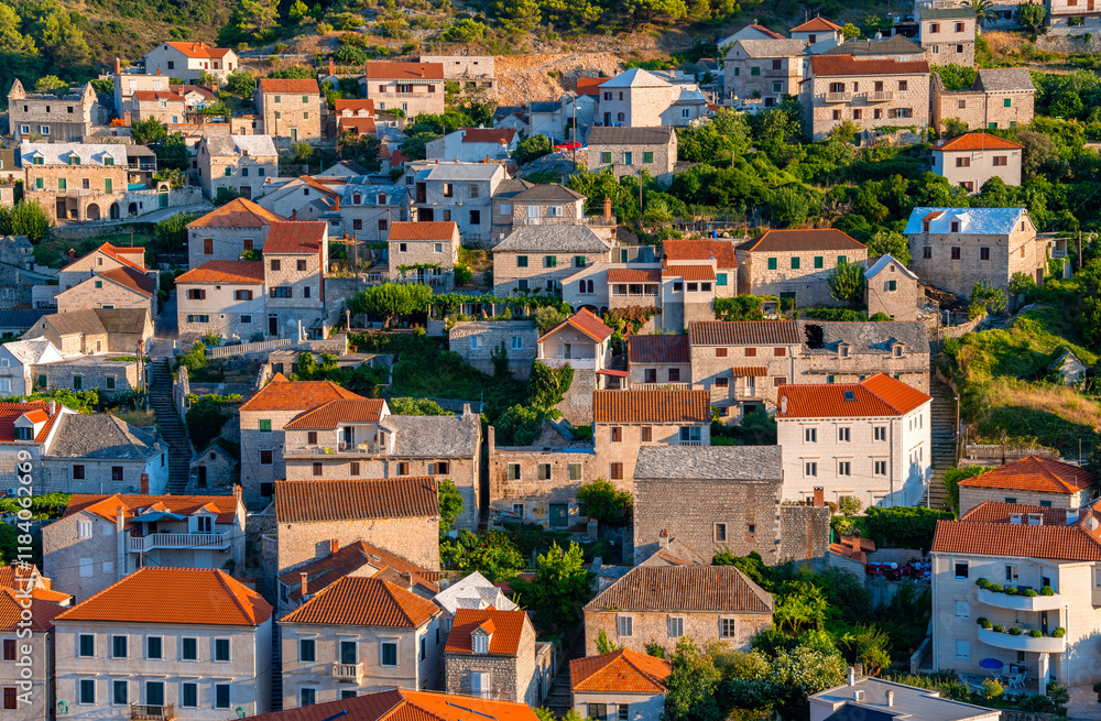 Pučišća on the Croatian vacation island of Brač is a popular vacation destination for tourists. Panorama of the idyllic seaside resort on the Adriatic Sea in Dalmatia with typical limestone houses. Pučišća on the Croatian vacation island of Brač is a popular vacation destination for tourists. Panorama of the idyllic seaside resort on the Adriatic Sea in Dalmatia with typical limestone houses.