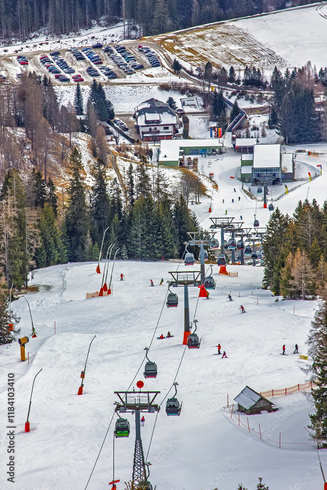 Skiers Enjoying Snowy Mountain Slopes Skiers Enjoying Snowy Mountain Slopes