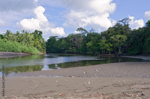 sirena river and estuary to pacific ocean on osa peninsula at corcovado national park in costa rica photo