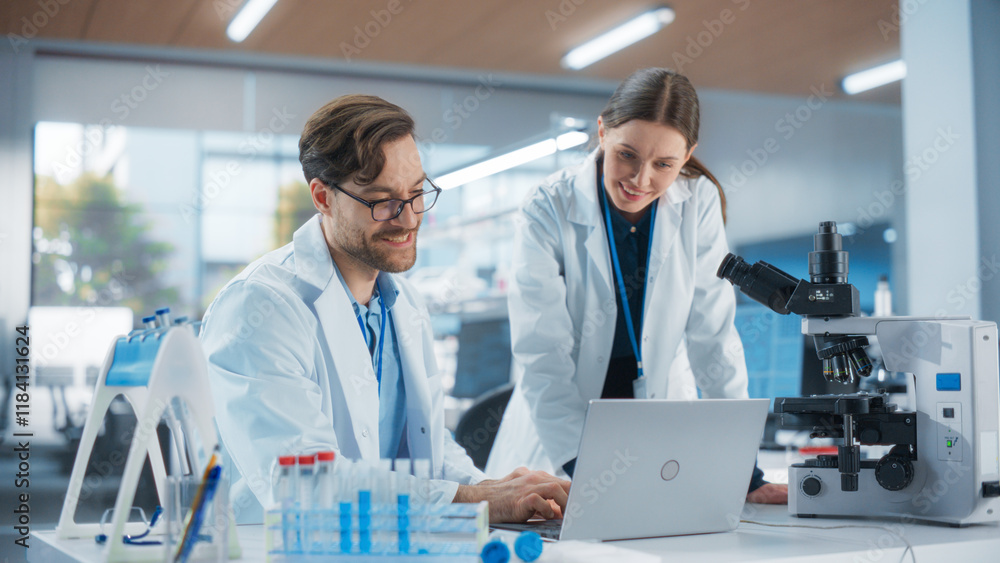 Scientists Working Together on a Research Project. Young Man and a Female in Modern Medical Laboratory Talking About Vaccine Development Methods, Gene Editing Studies, Biotechnology Breakthroughs Scientists Working Together on a Research Project. Young Man and a Female in Modern Medical Laboratory Talking About Vaccine Development Methods, Gene Editing Studies, Biotechnology Breakthroughs