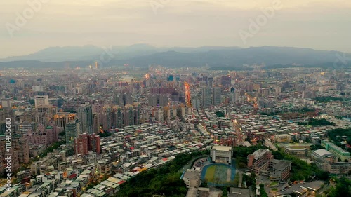 Wallpaper Mural TAIWAN, CHINA - JANUARY 7, 2025: Aerial view showcases the sprawling urban landscape of Taipei with mountain backdrop and diverse neighborhoods Torontodigital.ca