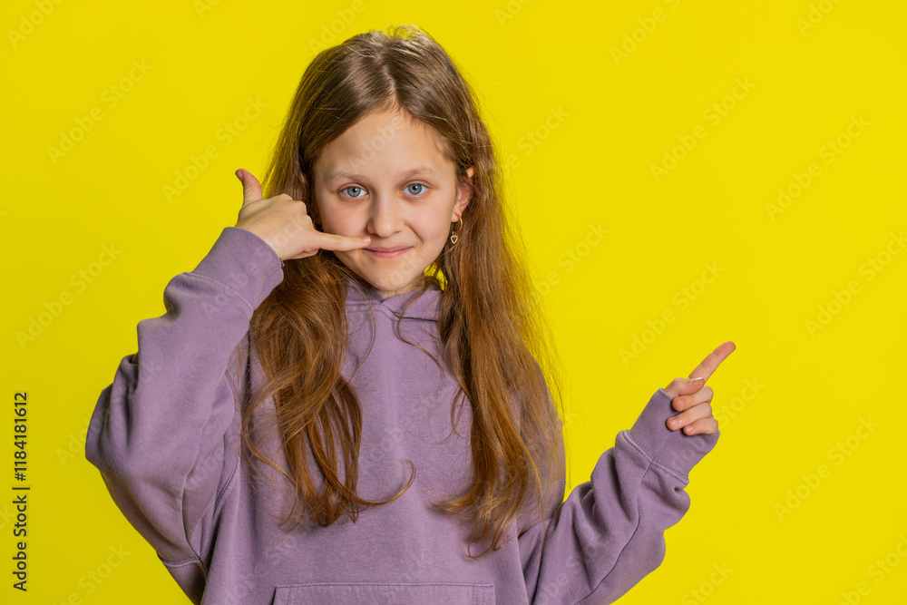 Call me, here is contact number. Portrait of child girl kid looking at camera doing phone gesture, asking for conversation. Hotline service proposition advertisement. Children on yellow background Call me, here is contact number. Portrait of child girl kid looking at camera doing phone gesture, asking for conversation. Hotline service proposition advertisement. Children on yellow background