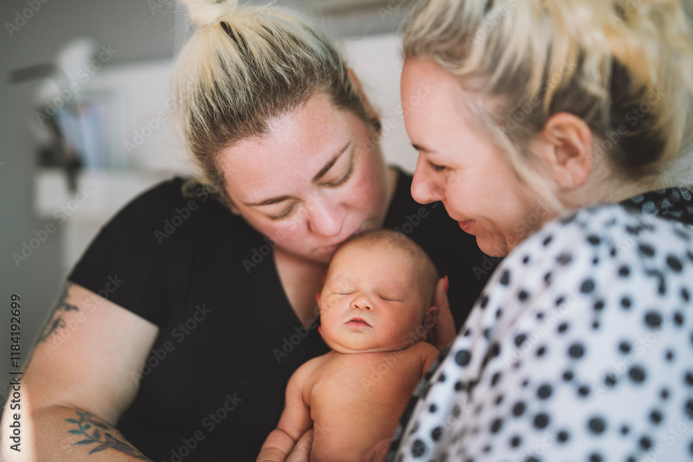 Women gay couple having fun with their baby daughter at home. Women gay couple having fun with their baby daughter at home.