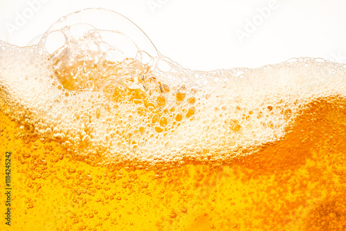 Close up bright orange Oil or beer splash texture and nature waves, Beautiful waves curve and little bubbles smooth for graphic design and background, Oil Bubbles, Soft beer bubbles, Selective focus photo