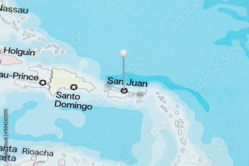 Macro photo of a white pin needle into San Juan city of Puerto Rico political map 