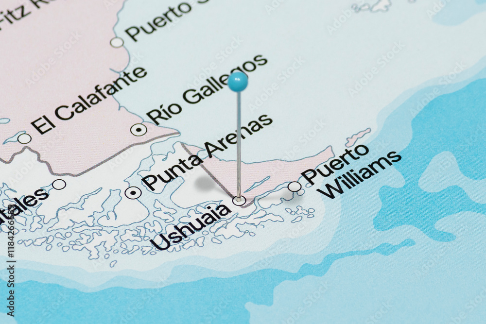 Obraz premium Macro photo of a light blue pin needle into Ushuaia city of Argentina political map 