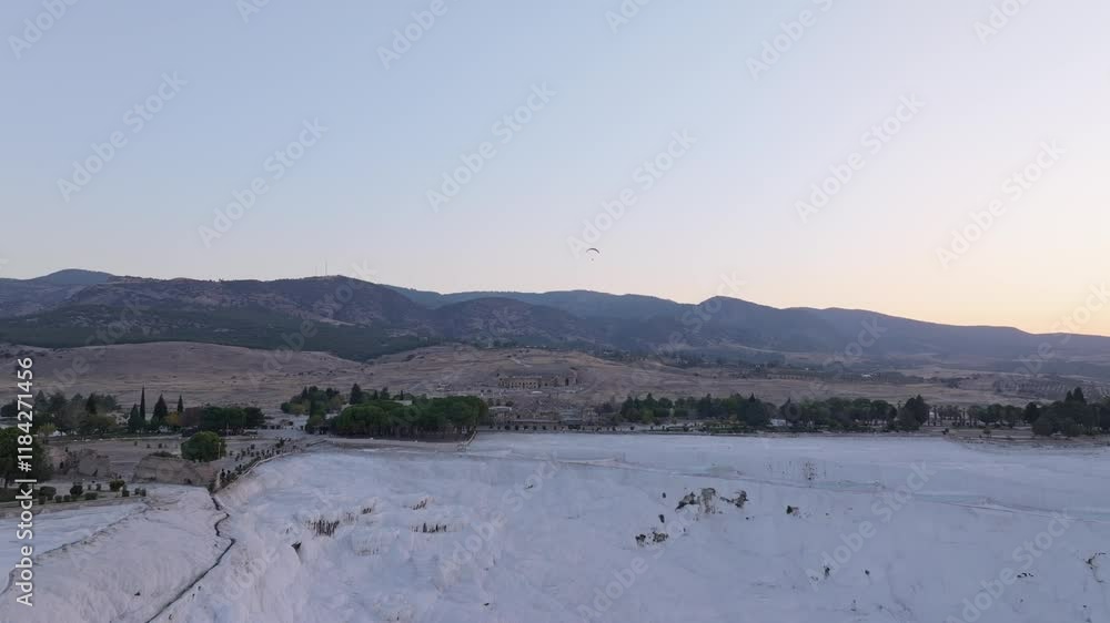 Aerial view of travertines of Pamukkale at sunrise with hot air balloons, Pamukkale, Turkey. Aerial view of travertines of Pamukkale at sunrise with hot air balloons, Pamukkale, Turkey.