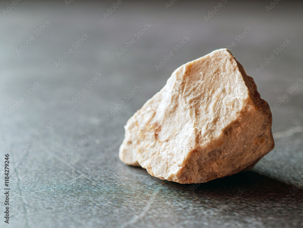 One limestone on a grey background. One limestone on a grey background.