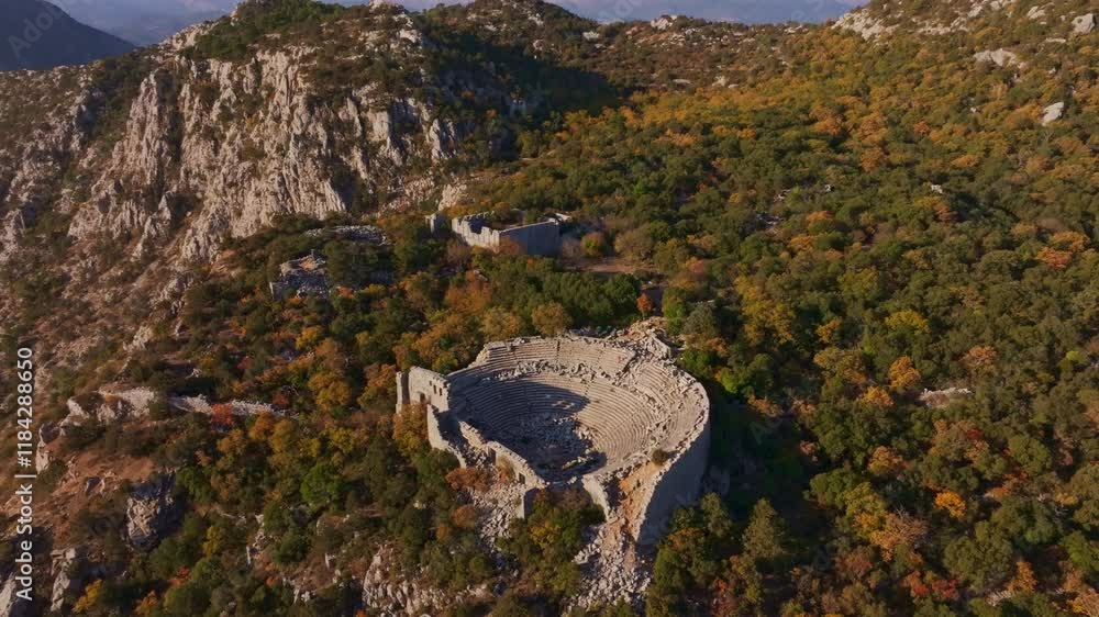 Aerial view of ancient theatre ruins amidst beautiful autumn landscape and forest, Termessos, Antalya, Turkey. Aerial view of ancient theatre ruins amidst beautiful autumn landscape and forest, Termessos, Antalya, Turkey.