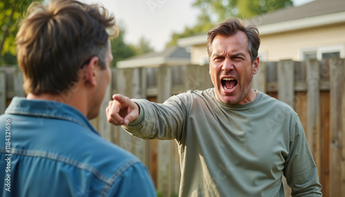 Angry neighbor  Angry man yelling and pointing during backyard argument