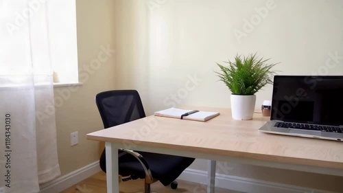 Wallpaper Mural A small office with a laptop and a potted plant on a desk. The room is empty and the desk is the only furniture in the room Torontodigital.ca