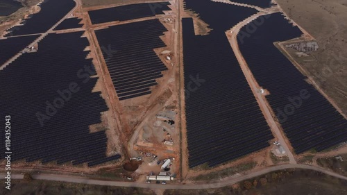 Aerial view of solar farm with photovoltaic panels and surrounding landscape, Sideras, Greece. photo