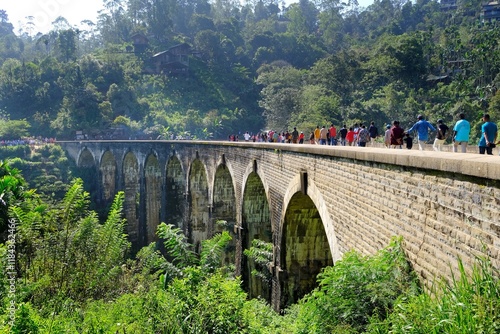 Landscape with iconic Nine Arch Bridge in Ella and a lot of walking people on it, Nuwara Eliya, Sri Lanka photo