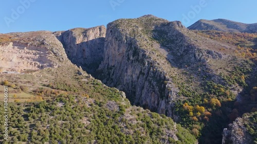 Aerial view of breathtaking gorge with rugged cliffs and serene valley, Corovode, Albania. photo