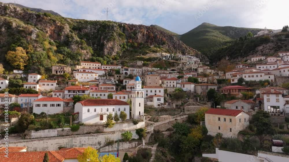 Aerial view of charming village with historic architecture and scenic mountains, Dhermi, Albania. Aerial view of charming village with historic architecture and scenic mountains, Dhermi, Albania.