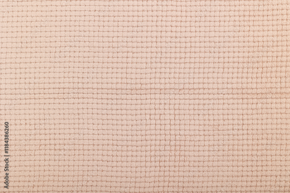 Texture of beige textile fabric. Texture of the back side of the carpet. Texture of beige textile fabric. Texture of the back side of the carpet.