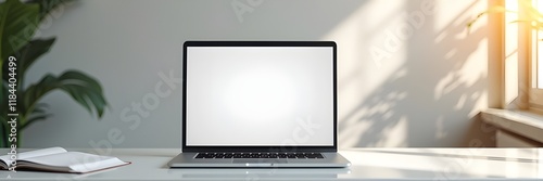 A modern desk with a laptop displaying an e-commerce website homepage