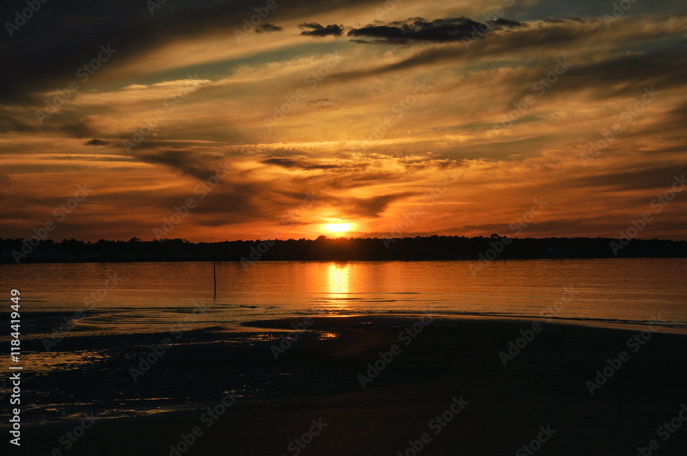 Dramatic golden sunset at Ile de Re island near La Rochelle. Charente-Maritime, Nouvelle-Aquitaine, France. Majestic nature, scenic evening landscape background. Dramatic golden sunset at Ile de Re island near La Rochelle. Charente-Maritime, Nouvelle-Aquitaine, France. Majestic nature, scenic evening landscape background.