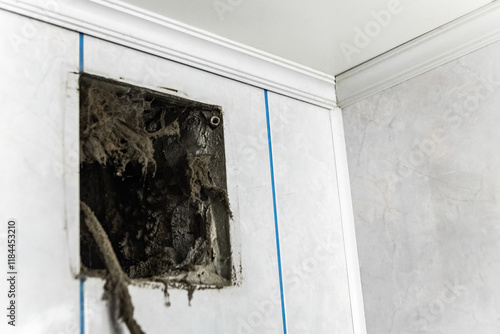Dust, dirt, debris, and cobwebs accumulating in a ventilation grille indicate poor air quality and potential fire hazard, emphasizing the importance of regular cleaning and maintenance. Housework