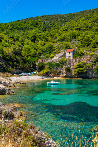 Small picturesque bay with fisherboats on Bisevo Island Croatia in the mediterranean adriatic sea, a paradise for water sports, fishing, summer holiday in natural surrounding. Turquoise clear water. photo