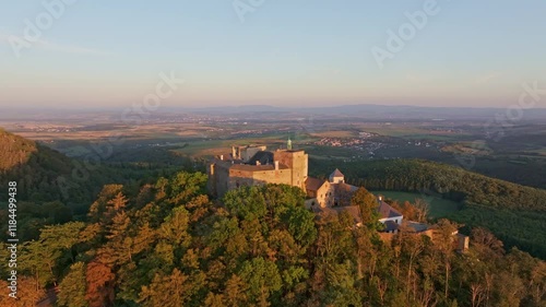 Aerial view of buchlov castle surrounded by a scenic landscape and forest at sunset, buchlovice, czech republic. photo