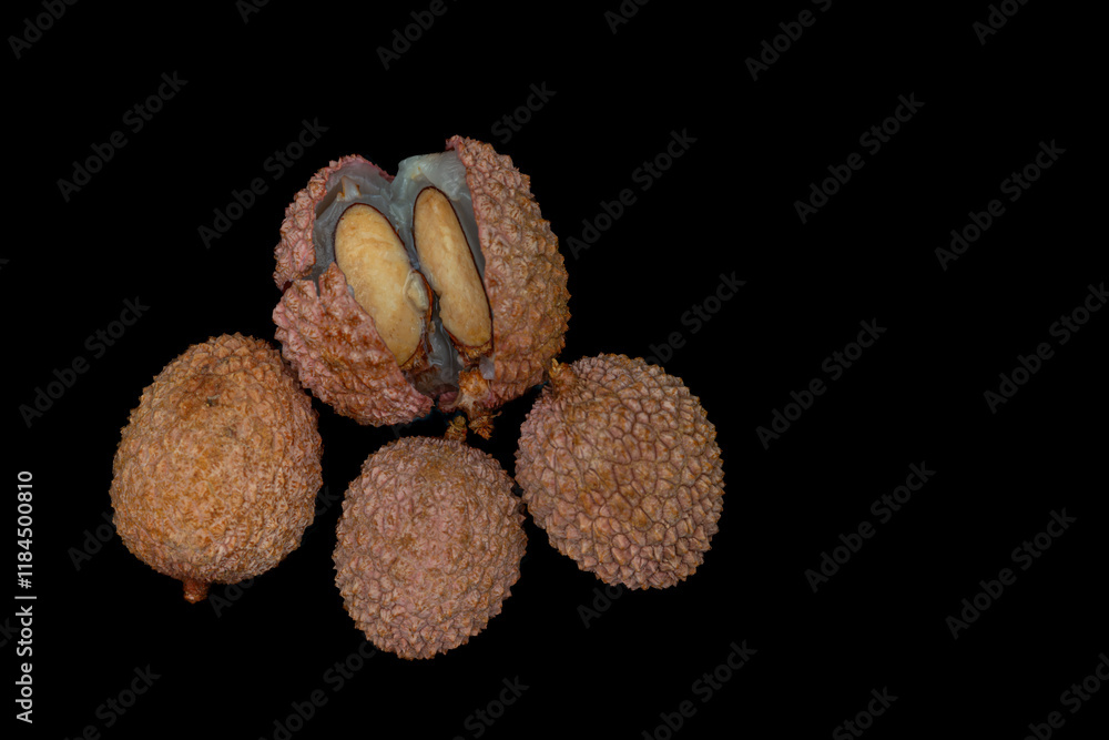 Lichi fruit with fresh juice on black table Lichi fruit with fresh juice on black table