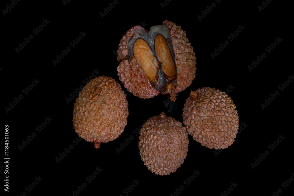 Lichi fruit with fresh juice on black table Lichi fruit with fresh juice on black table