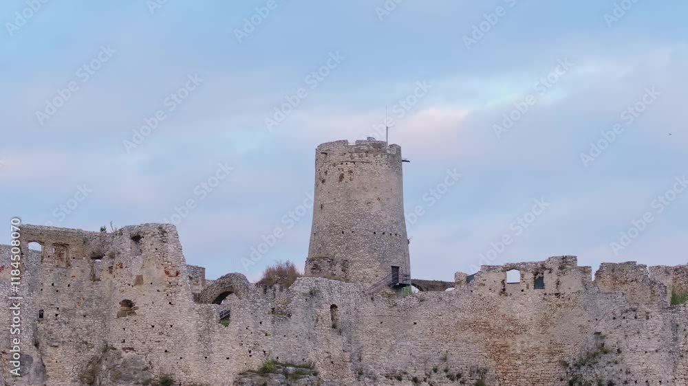 Aerial view of Spis Castle at sunrise with majestic stone walls and ancient towers, Spisske Podhradie, Slovakia. Aerial view of Spis Castle at sunrise with majestic stone walls and ancient towers, Spisske Podhradie, Slovakia.