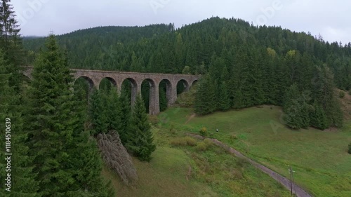 Aerial view of chmarossky viadukt bridge surrounded by lush forest and scenic landscape, Telgart, Slovakia. photo