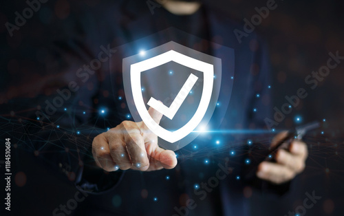 Obraz na płótnie Businessman use mobile phone technology with advanced cyber security shield, ensuring the protection of sensitive data and securing the digital environment against potential threats. w salonie