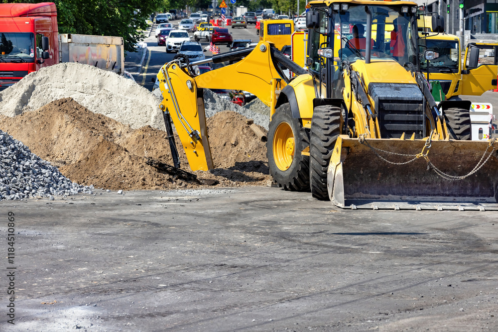 Construction machinery at work transforming the urban landscape amid heavy traffic. Copy space.