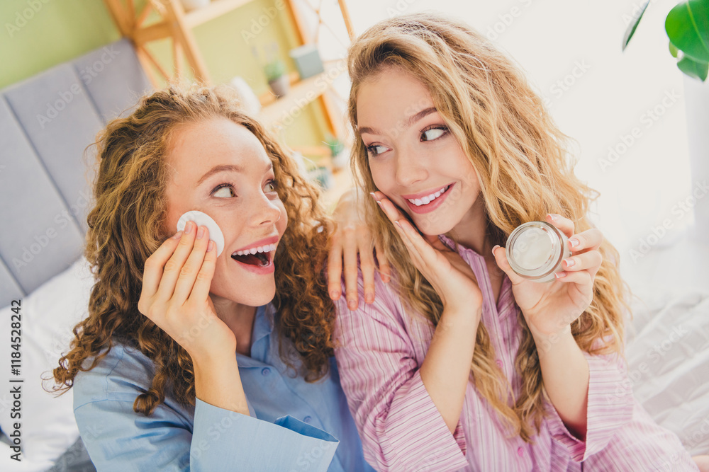 Photo of two pretty young females daily routine cosmetics sponge dressed enjoy wake up modern cozy day light bedroom home interior Photo of two pretty young females daily routine cosmetics sponge dressed enjoy wake up modern cozy day light bedroom home interior
