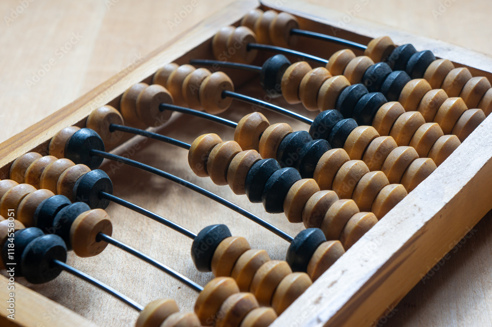 Antique wooden abacus on a wooden table Antique wooden abacus on a wooden table