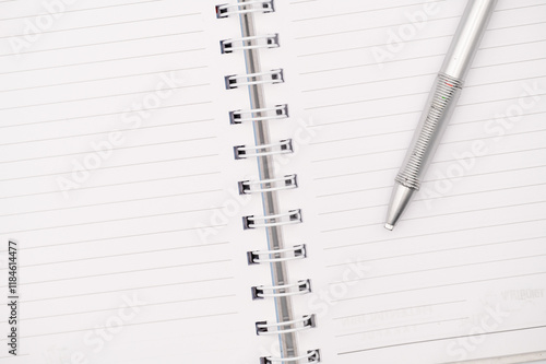 Writer's Ready:  Open Notebook with Pen on Crisp White Pages photo