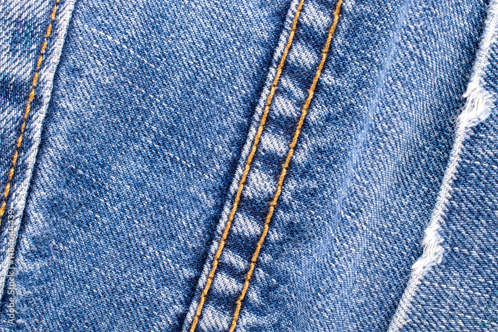 Separate fragments of good old jeans, macro, top view. Separate fragments of good old jeans, macro, top view.