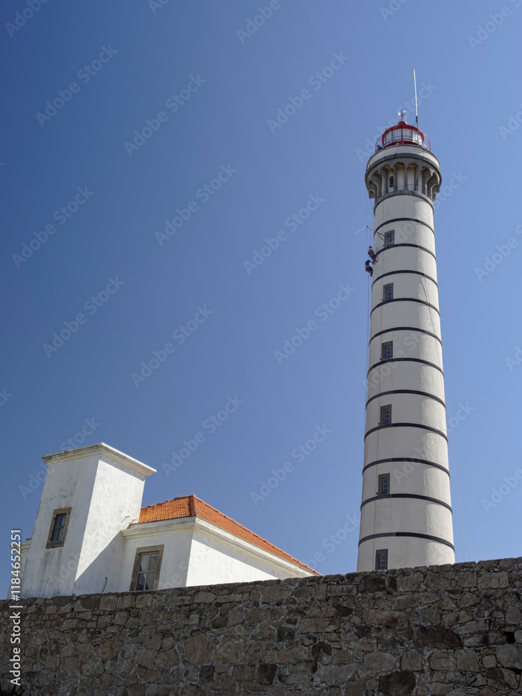 Lighthouse maintenance by professional climbers Lighthouse maintenance by professional climbers