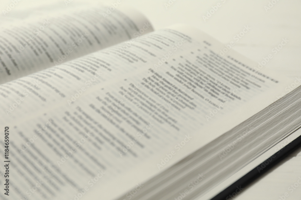 Open Holy Bible in English language on table, closeup Open Holy Bible in English language on table, closeup
