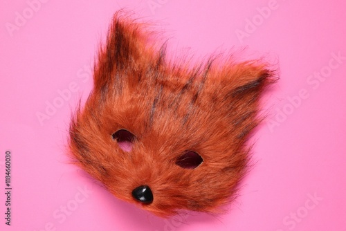 Quadrobics. Fox mask on pink background, top view photo