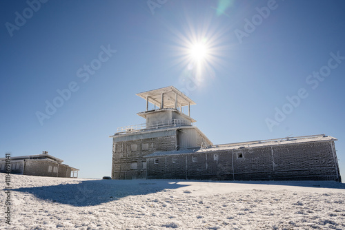 View of Golyam Kademliya Shelter surrounded by snow in the Balkan mountains, Gabrovo, Bulgaria. photo