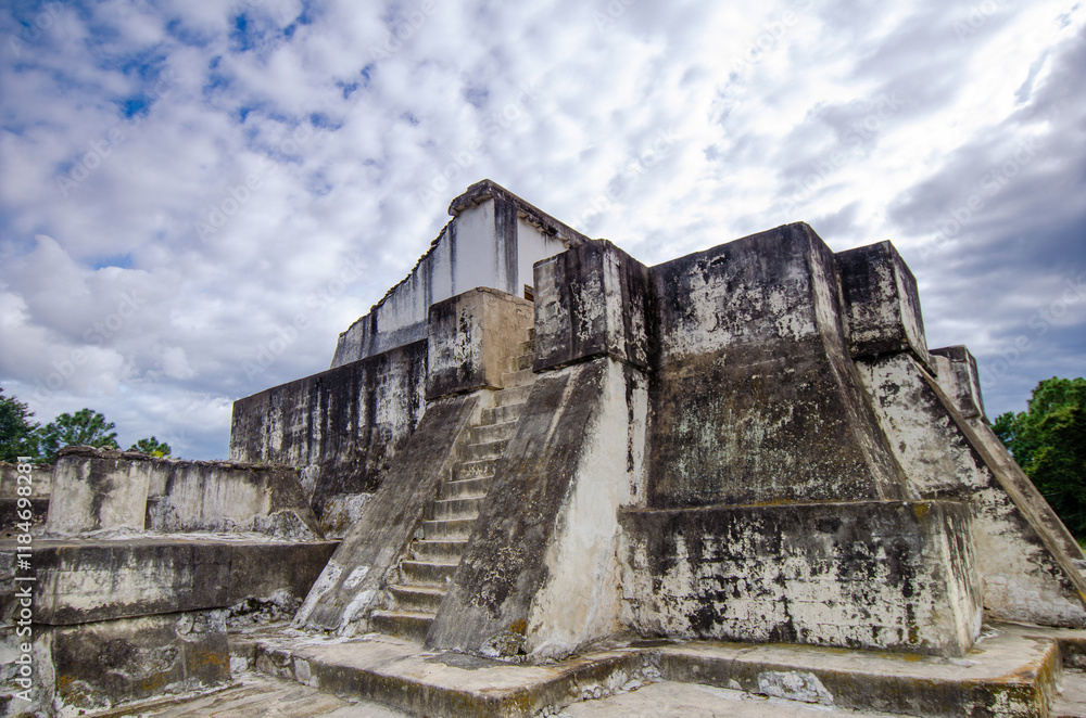 Restored remains of the Mayan city of Zaculeu. Imposing pyramid-shaped buildings, surrounded by mountains close to the clouds. Restored remains of the Mayan city of Zaculeu. Imposing pyramid-shaped buildings, surrounded by mountains close to the clouds.