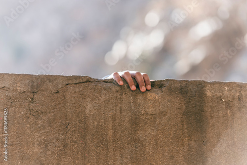 View of textured wall with hand gripping, Shri Galta Peeth, Monkey Temple, Jaipur, Rajasthan, India. photo