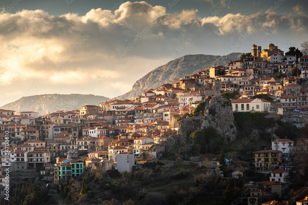 Sunset over Arachova city at Parnassus Mountain resort. Beautiful landscape with Arachova and its amazing architecture Greek constructions. Travel to Greece.