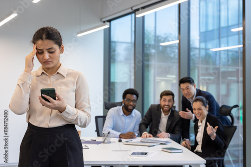 Colleagues mocking a woman inside the office, unethical behavior of company employees, discussing and ridiculing a young intern.