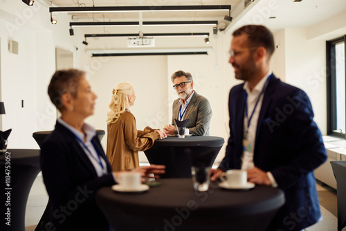 Coworkers exchanging ideas on seminar photo