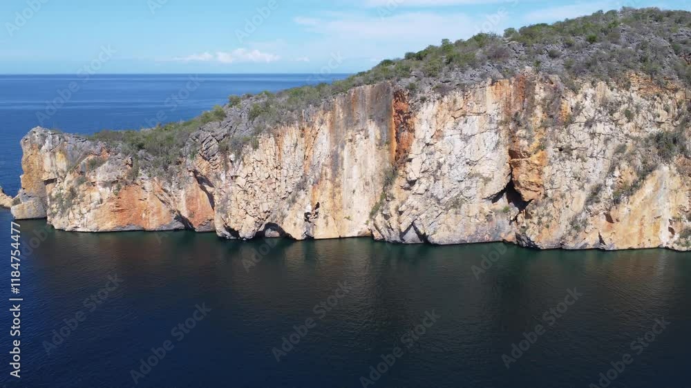 Majestic cliffs and turquoise waters at Playa Manare, Mochima National Park, Venezuela. A breathtaking drone view of coastal rock formations, lush vegetation, and pristine ocean scenery Majestic cliffs and turquoise waters at Playa Manare, Mochima National Park, Venezuela. A breathtaking drone view of coastal rock formations, lush vegetation, and pristine ocean scenery
